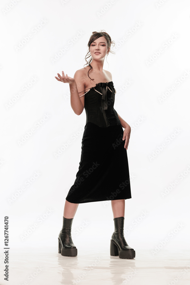 Young beautiful girl brunette of an eastern outbreak of black dress on a white background Young beautiful girl brunette of an eastern outbreak of black dress on a white background