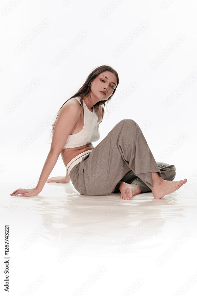 Fototapeta premium Young girl posing on a white background