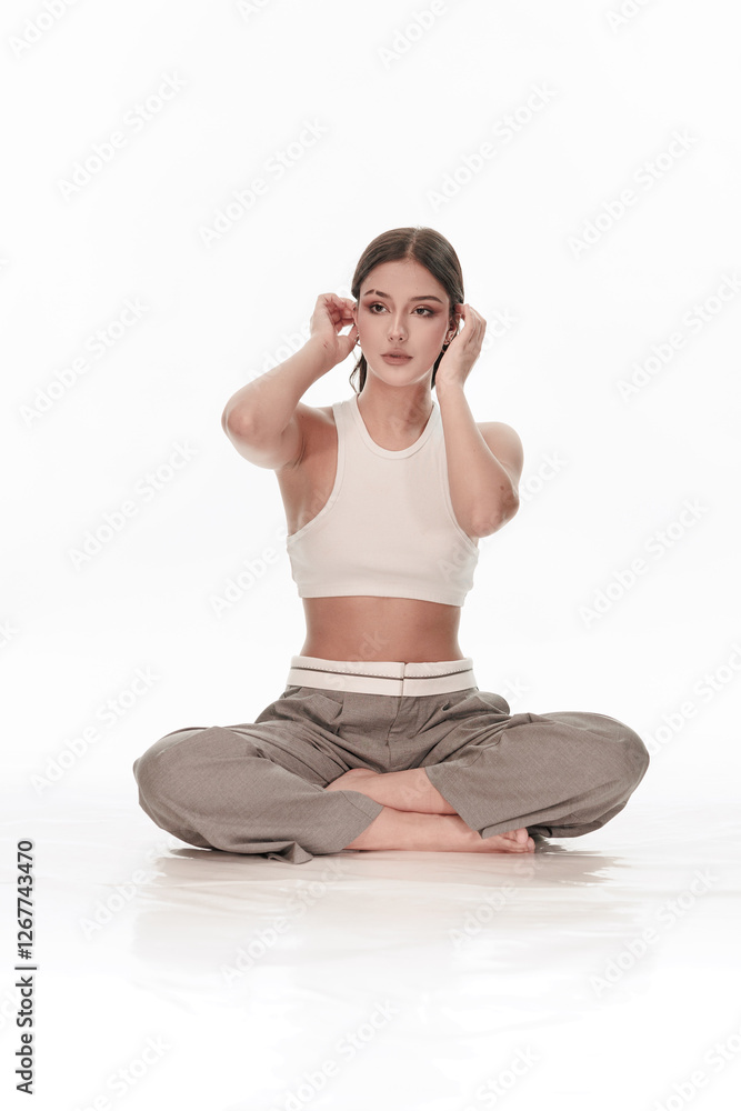 Fototapeta premium Young girl posing on a white background