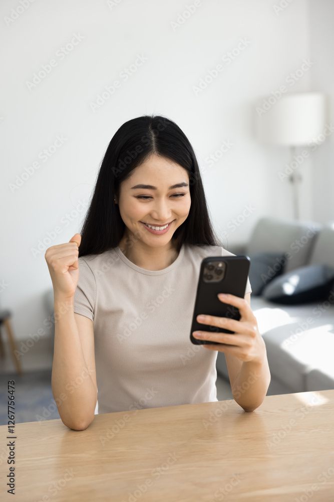 Vertical view happy Asian woman enjoy great news received in sms, get invitation, university admission notification, receive sell-out and huge discounts commercial offer. Achievements, victory moment Vertical view happy Asian woman enjoy great news received in sms, get invitation, university admission notification, receive sell-out and huge discounts commercial offer. Achievements, victory moment