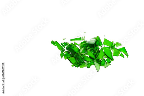 Sharp and jagged pieces of broken green glass cut out on a white background, symbolizing fragility and caution.
