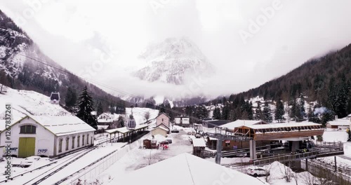 Time lapse Valenciennes, a town in the morning hours, fast movement of people, cable car with gondolas, movement of clouds on the slope of a snow-capped mountain, French Alps, Chamonix, France, 4K, 24 photo