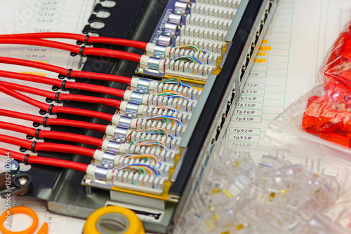 Ethernet patch panel with twisted pair wires connected.  photo