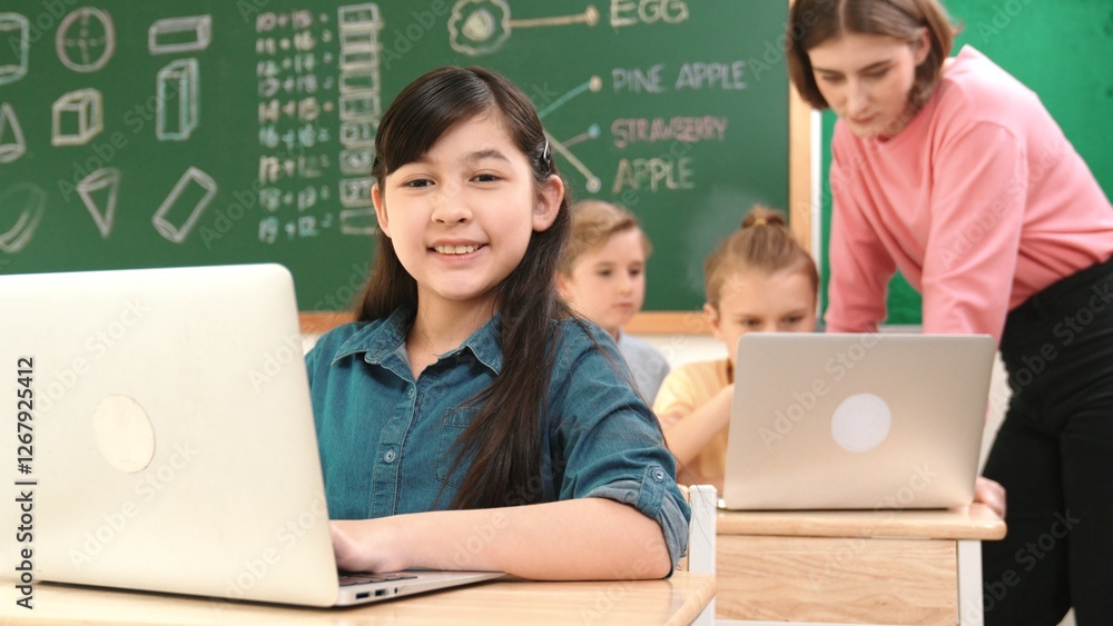 Smart asian girl looking at camera while coding engineering prompt. Multicultural student learning about generated AI while teacher teaching about system or checking classwork at STEM class. Pedagogy. Smart asian girl looking at camera while coding engineering prompt. Multicultural student learning about generated AI while teacher teaching about system or checking classwork at STEM class. Pedagogy.