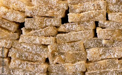 Traditional Turkish delight bars with appricots and hazelnuts sold in a nut shop photo