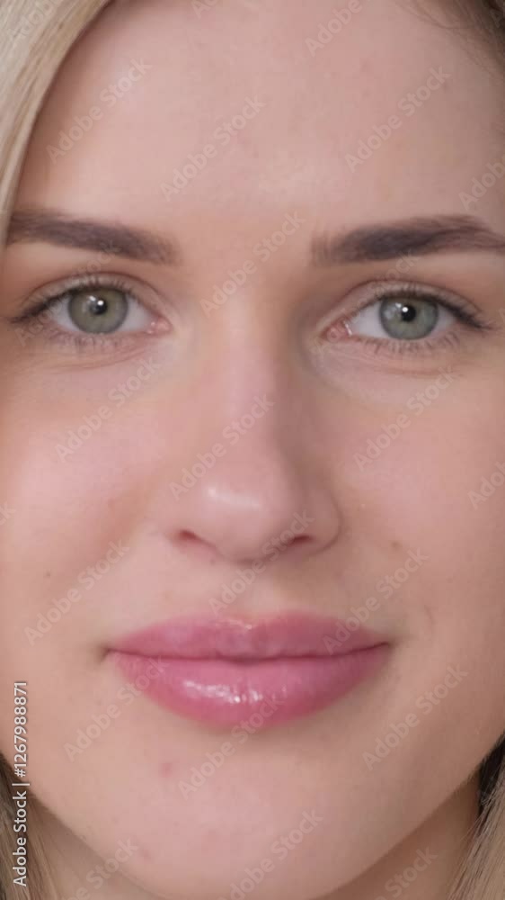 Close-up of a beautiful woman with light blond hair and stunning blue eyes that captivate Close-up of a beautiful woman with light blond hair and stunning blue eyes that captivate