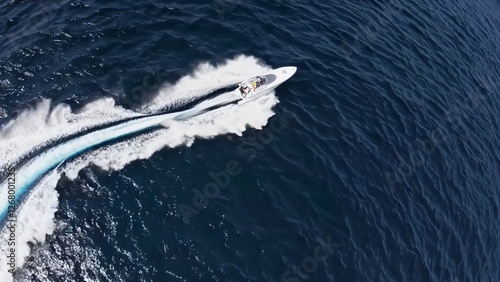 Wallpaper Mural Sleek white speedboat racing across deep navy waters, carving dramatic white wake while zooming at high velocity, viewed from aerial perspective in cinematic slow motion Torontodigital.ca