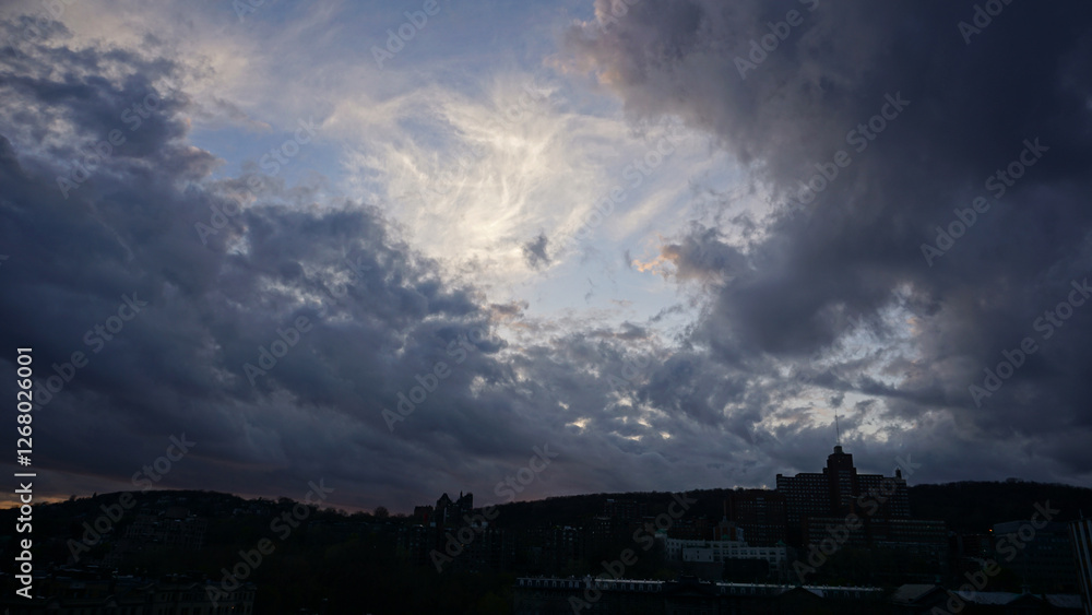 The red and blue dancing clouds with setting sun