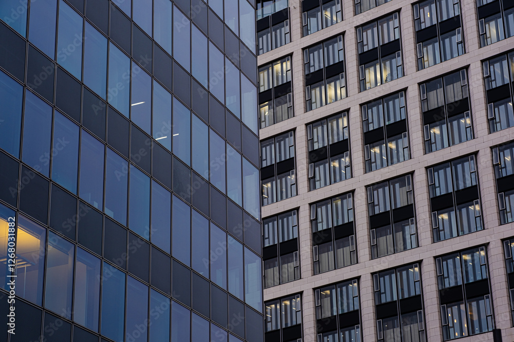 Business background. Modern architecture. Beautiful modern buildings made of glass and stone. Business quarter in Germany Business background. Modern architecture. Beautiful modern buildings made of glass and stone. Business quarter in Germany