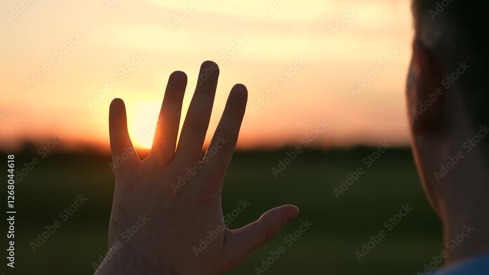 man against sunset, view from back man, man's hand glare sunset, hand glare sunlight, man prayer evening sunset, rays dawn through fingers, prayer God light ask forgiveness, rays dawn through God man against sunset, view from back man, man's hand glare sunset, hand glare sunlight, man prayer evening sunset, rays dawn through fingers, prayer God light ask forgiveness, rays dawn through God