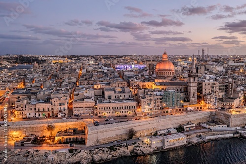 Photography A sweet view of Valletta's sunset, highlighting the city's sparkle under the evening sky