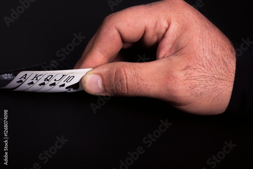 Man plays and looks at cards