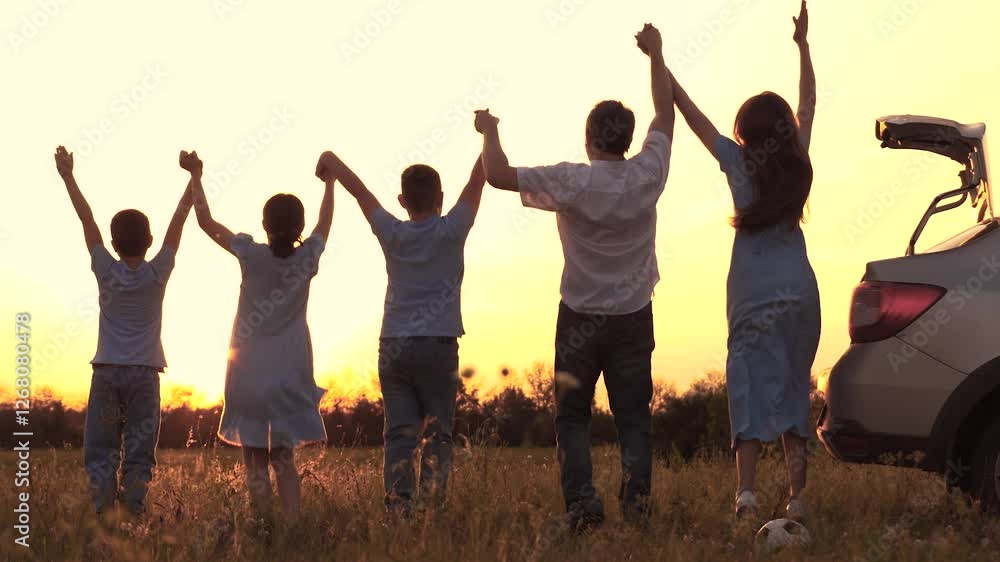 Happy family. Mother father son daughter jumping sunset by car. happy family trip large family. woman man children nature. children outdoor recreation. children picnic. Parents daughter son holding Happy family. Mother father son daughter jumping sunset by car. happy family trip large family. woman man children nature. children outdoor recreation. children picnic. Parents daughter son holding