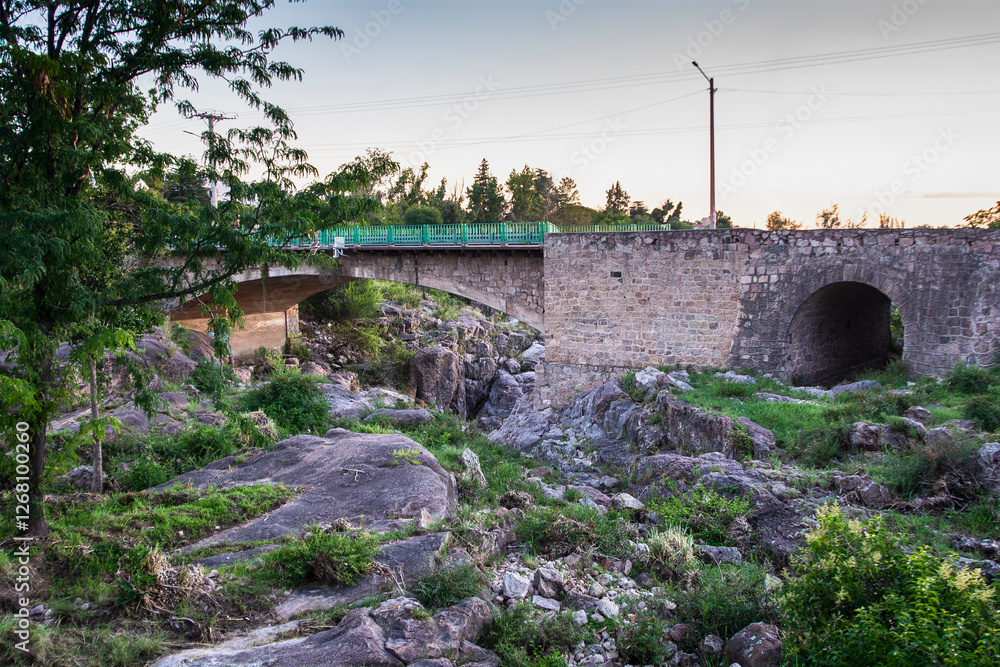 custom made wallpaper toronto digitalA bridge over a river with a green train crossing it