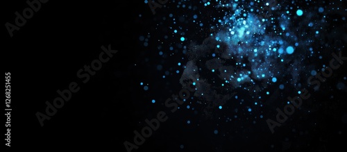 Abstract blue sparkles on black background.