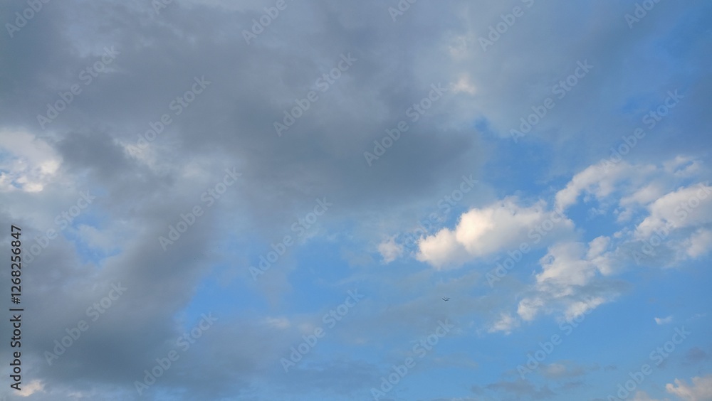 Blue sky with clouds and sun reflection.The sun shines bright in the daytime Blue sky with clouds and sun reflection.The sun shines bright in the daytime