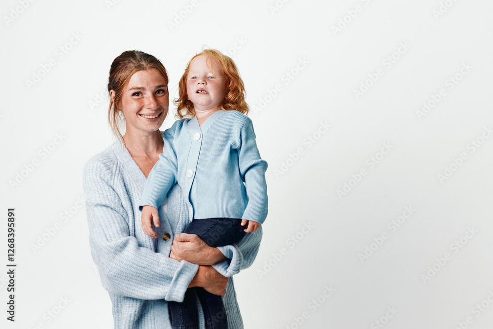Mother and child embracing in blue sweater against white background love, family, connection, warmth, comfort, parenting, bonding, happiness, togetherness Mother and child embracing in blue sweater against white background love, family, connection, warmth, comfort, parenting, bonding, happiness, togetherness