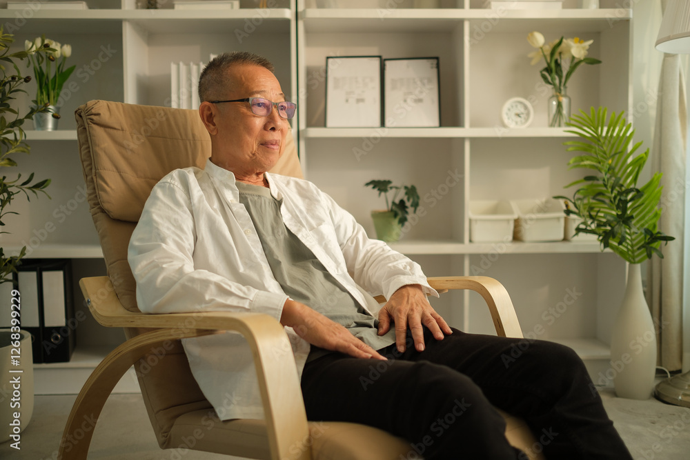 An elderly man wearing glasses a Relaxing in a rocking chair and looking thoughtfully away, An elderly man wearing glasses a Relaxing in a rocking chair and looking thoughtfully away,