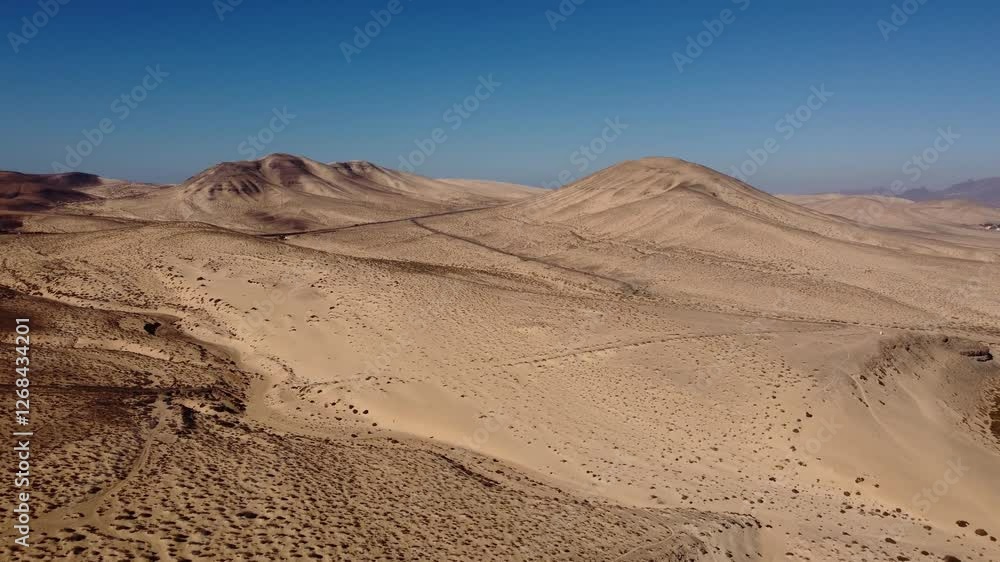 The sandy heart of Fuerteventura. Desert hills. Drone shot. The sandy heart of Fuerteventura. Desert hills. Drone shot.