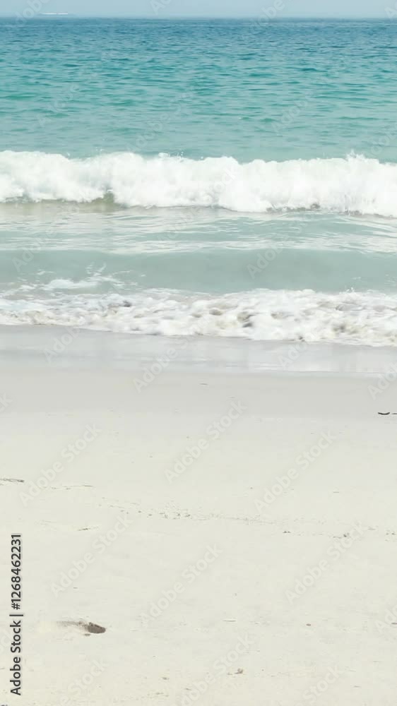 Rear view of pretty brunette looking at the ocean Rear view of pretty brunette looking at the ocean