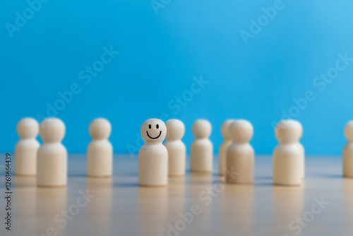 person standing smiling in a crowd, happy with himself, looking positive