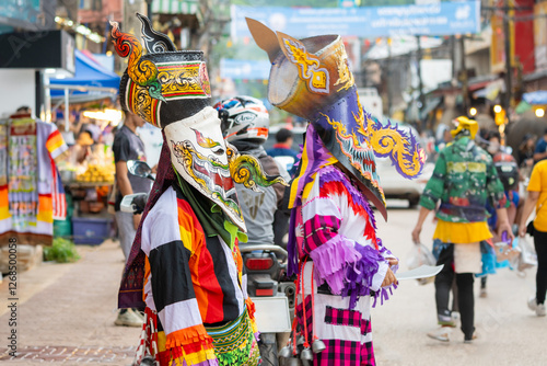 Loei, Thailand - July 6 2024  Phi Ta Khon festival Ghost mask and colorful costume Fun Traditional Tradition Very famous There are tourists around the world at Dan Sai Loei halloween of Thailand photo