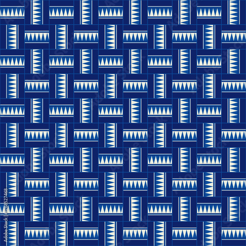 Geometric seamless pattern with interlocking rectangles and white triangles, creating a zigzag effect. Blue and white tile design for textiles, wallpapers, and backgrounds.