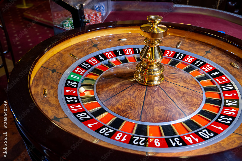 Roulette wheel. Casino. Gambling game. Roulette wheel on table in a casino. Roulette. The game in the casino. The concept of expectation of good luck. Roulette wheel. Casino. Gambling game. Roulette wheel on table in a casino. Roulette. The game in the casino. The concept of expectation of good luck.