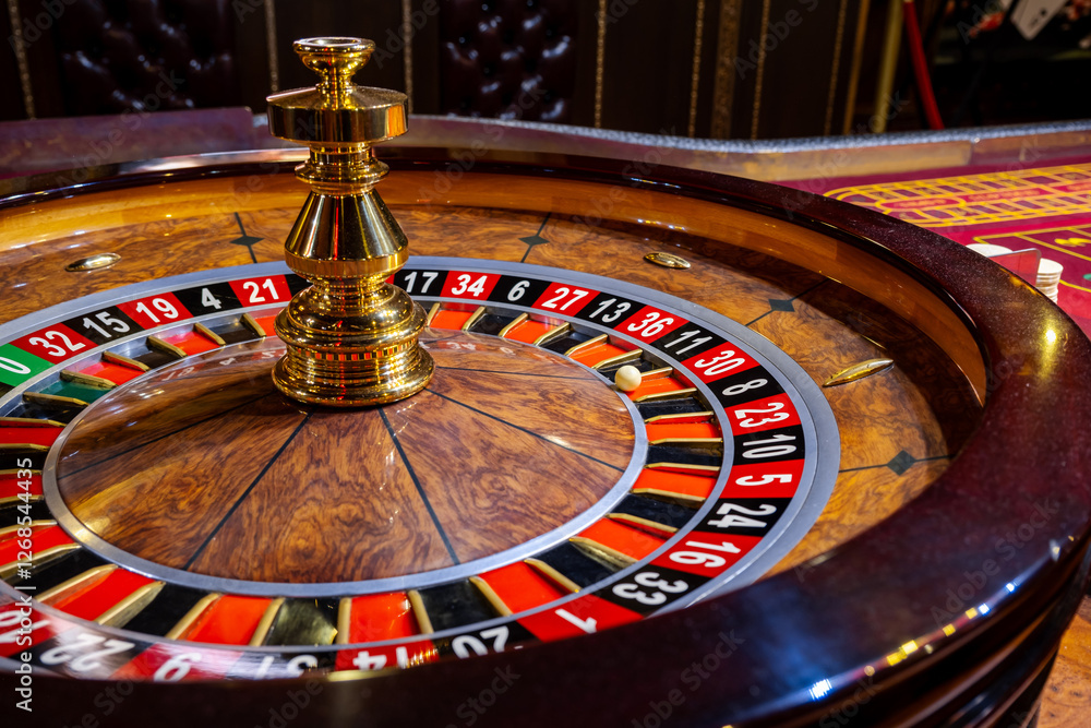 Roulette wheel. Casino. Gambling game. Roulette wheel on table in a casino. Roulette. The game in the casino. The concept of expectation of good luck. Roulette wheel. Casino. Gambling game. Roulette wheel on table in a casino. Roulette. The game in the casino. The concept of expectation of good luck.