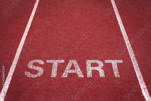 Red running track with white lanes in a stadium for athletics competitions and sprint races