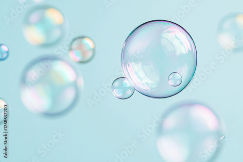 Wallpaper Mural Floating Transparent Soap Bubbles Against Soft Blue Background Torontodigital.ca