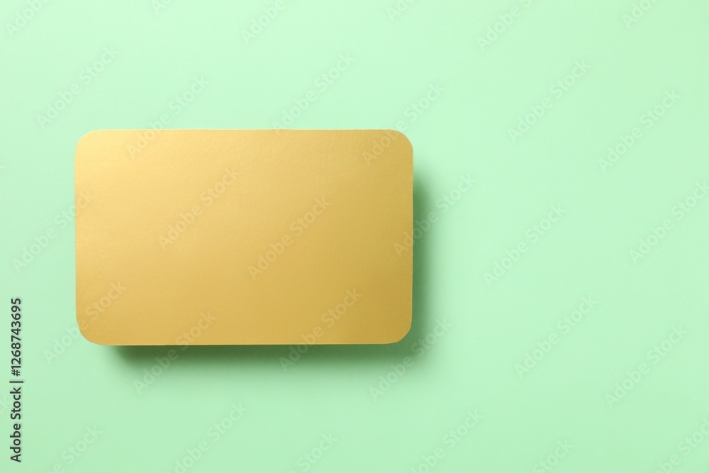 Golden paper card on color background Golden paper card on color background