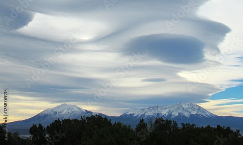 The Spanish Peaks are a pair of prominent mountains located in southwestern Huerfano County, Colorado. The Spanish Peaks were designated a National Natural Landmark in 1976.