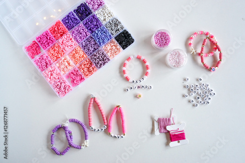 Obraz na plátně Diy friendship bracelets and beads on the table close up.