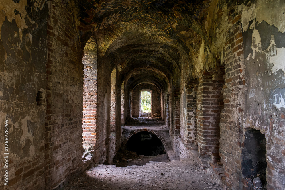 Fototapeta premium The ruins of the Roman Catholic Carmelite monastery and the Church of the Immaculate Conception of the Virgin Mary in the village of Kysylyn, Volyn region, Ukraine, July 10, 2023