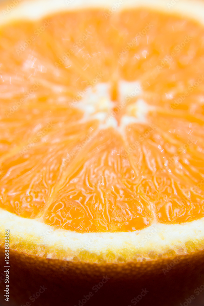 Oranges cut in half, cross-section, flesh.