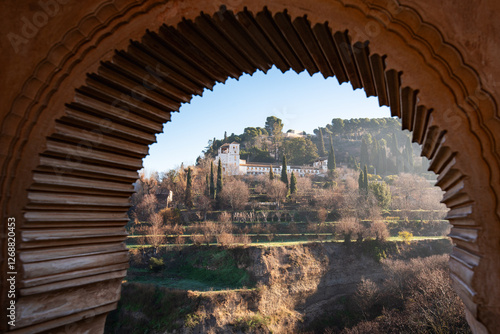 The Generalife and its orchard as seen from a window of the Partal Palace, The Alhambra, Granada. photo