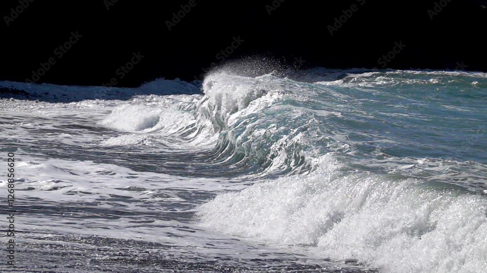 Powerful waves breaking over dark sand in Ajuy, Canaries. 10x slow motion Powerful waves breaking over dark sand in Ajuy, Canaries. 10x slow motion