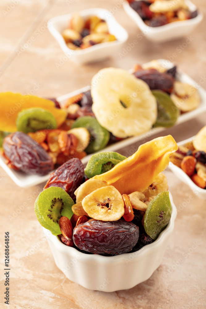 Dried tropical fruits with various nuts and raisins. Dried tropical fruits with various nuts and raisins.