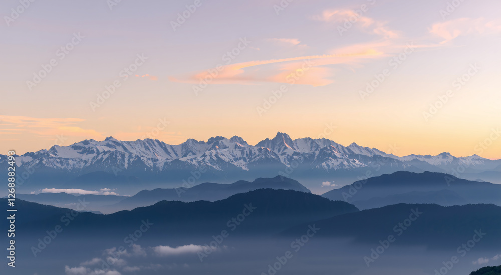 Snow Capped Mountain Range Landscape with Golden Sunset Sky and Layered Mountain Peaks