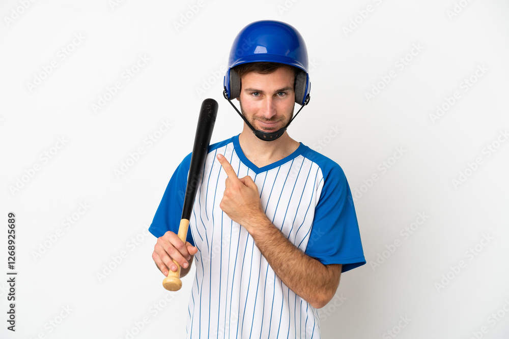 Young caucasian man playing baseball isolated on white background pointing to the side to present a product Young caucasian man playing baseball isolated on white background pointing to the side to present a product