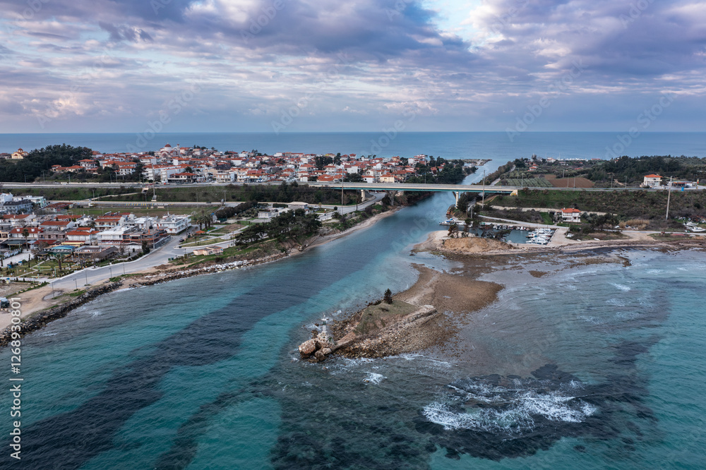 Fototapeta premium Aerial view at Nea Potidea canal, which connects Toroneos Bay with the Gulf of Thermaikos. Greece, Kassandra, Halkidiki