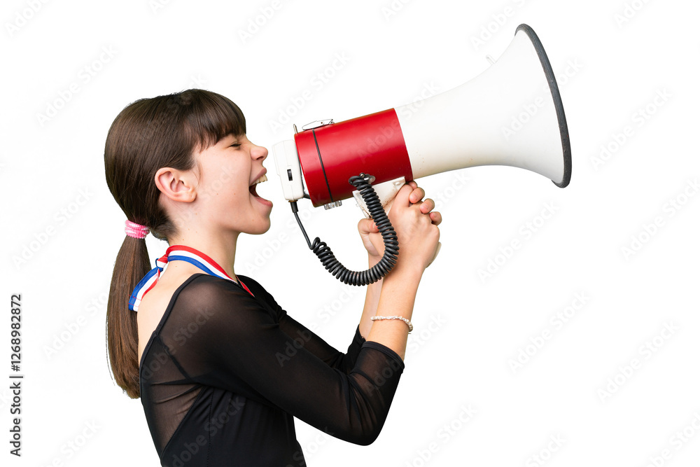 Little caucasian girl with medals over isolated background shouting through a megaphone Little caucasian girl with medals over isolated background shouting through a megaphone