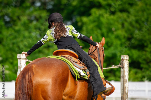 Junior rider competing in a western show