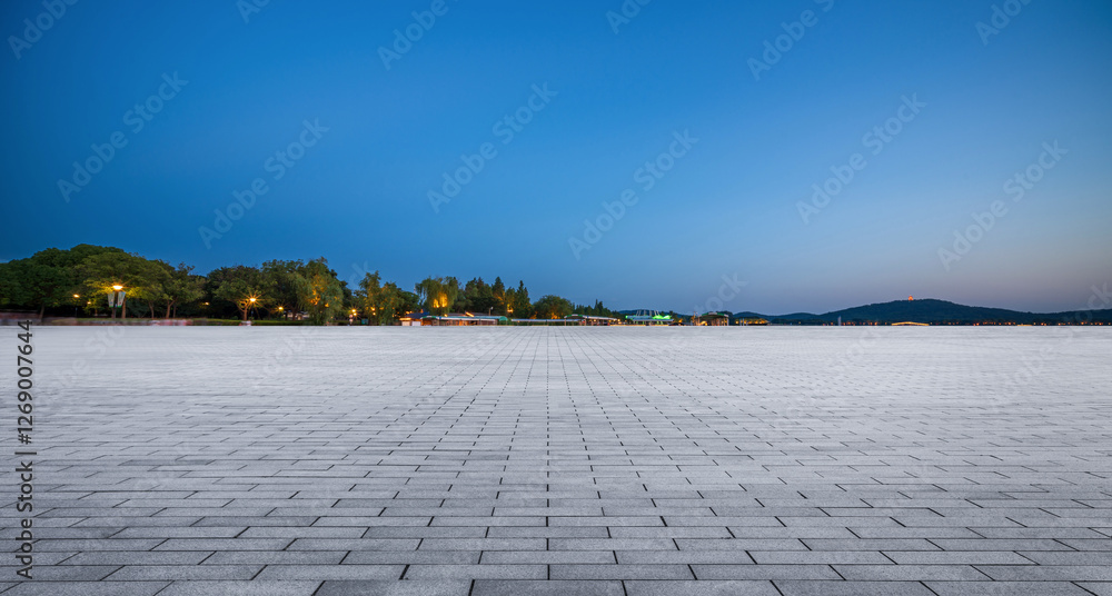 Fototapeta premium Tranquil Evening at a Spacious Paved Promenade by the Water