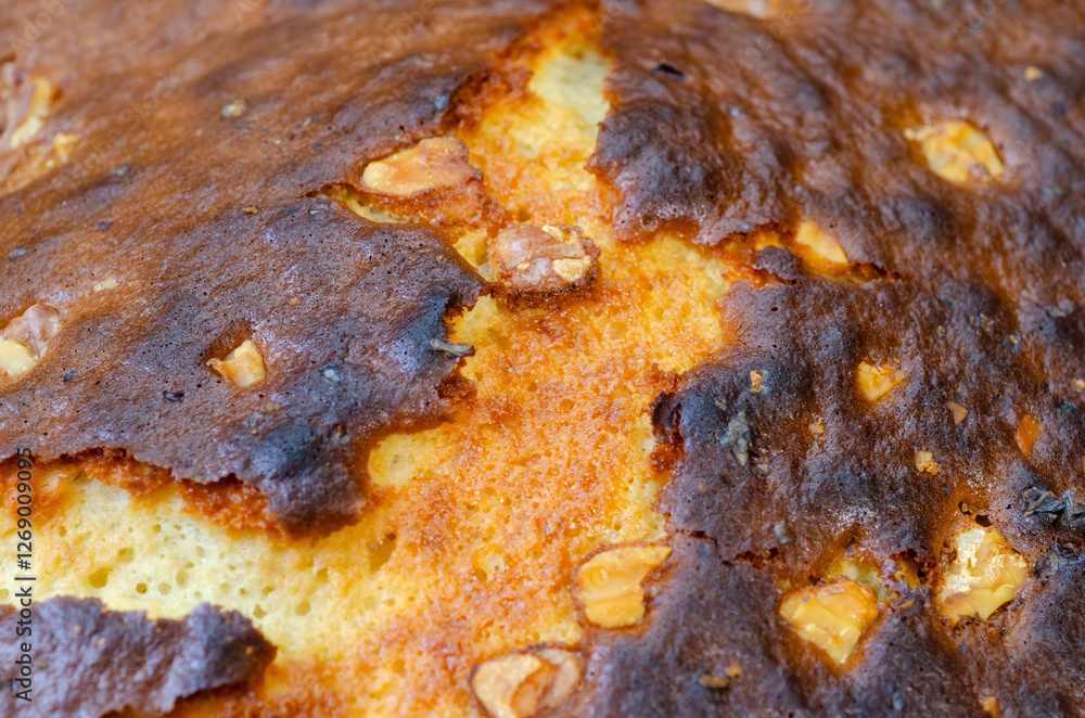 Fototapeta premium Close up of bake cake crust with nuts dessert