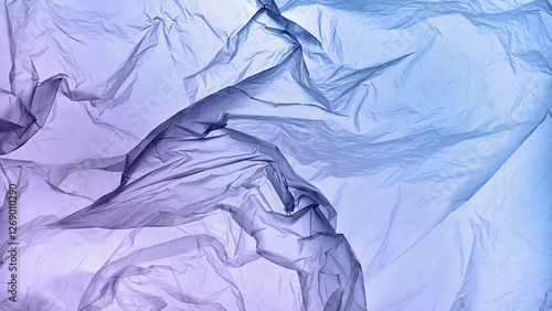 A textured blue and purple gradient crumpled paper background with natural creases and folds. Ideal for design projects, digital graphics, or creative presentations requiring a vibrant photo