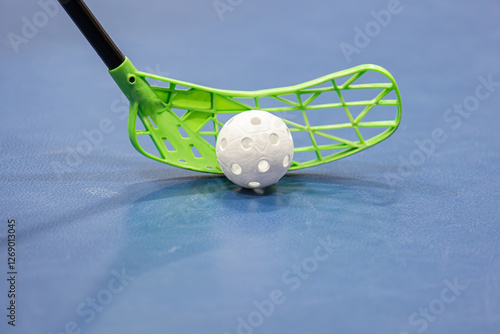 Close-up floorball stick and ball