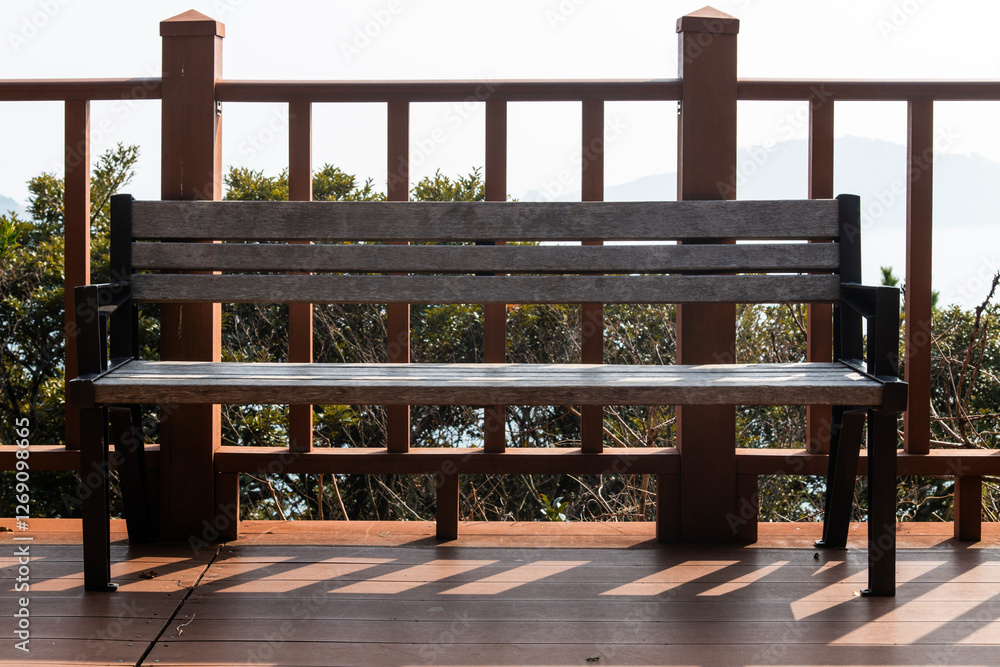 View of the wooden bench and fence at the seaside observatory View of the wooden bench and fence at the seaside observatory