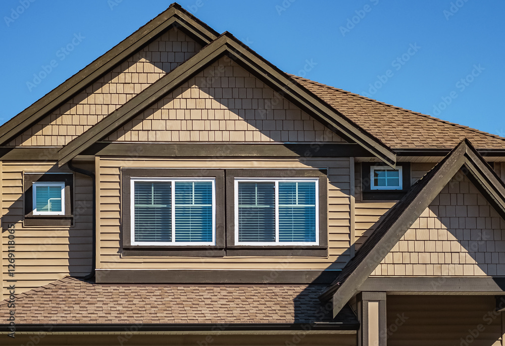 Facade of a house with nice windows. Real Estate Exterior Front House in a residential neighborhood. Facade of a house with nice windows. Real Estate Exterior Front House in a residential neighborhood.